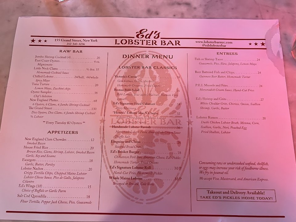 Printed menu highlighting clam chowder and fried seafood.